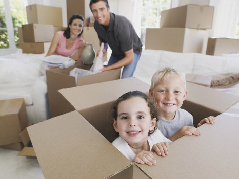 Removal team handling household items during a service booking