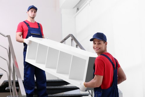 Mover wearing PPE while handling furniture