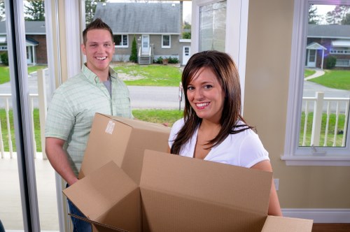 Packed moving boxes and furniture ready for relocation day