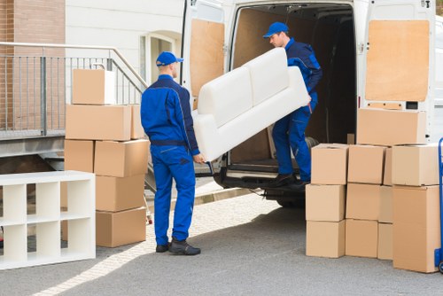 Loading furniture into a removal truck in Ham