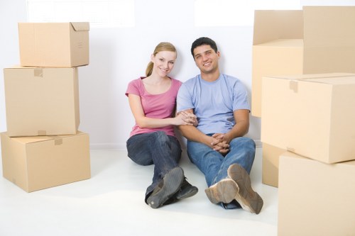 Professional house removalists packing and loading moving boxes in Ham