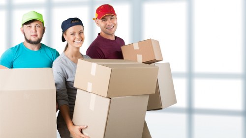 Packed moving boxes ready for flat removals in Ham