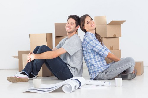 Local movers carrying furniture during a Ham relocation