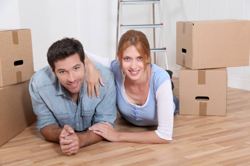 Professional movers loading furniture for a Ham same day move