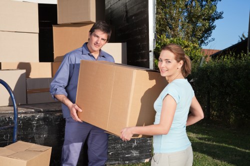 Professional movers loading furniture in Ham